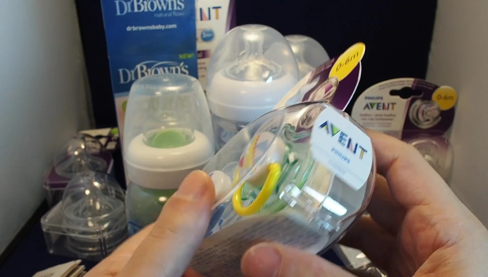 Opening the packaging of a Philips Avent pacifier.