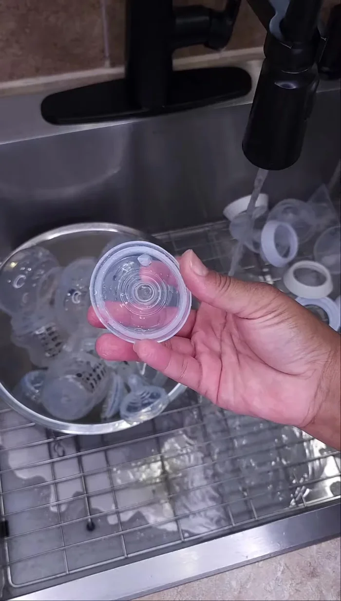Place disassembled bottle parts in boiling water for 5-10 minutes, ensuring all parts are fully submerged.