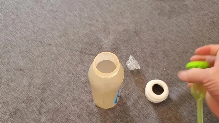 Identify the parts: anti-colic vent, nipple, ring, and bottle.