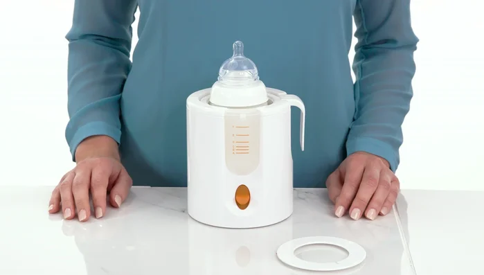 Plug in the warmer and turn it on using the on button.