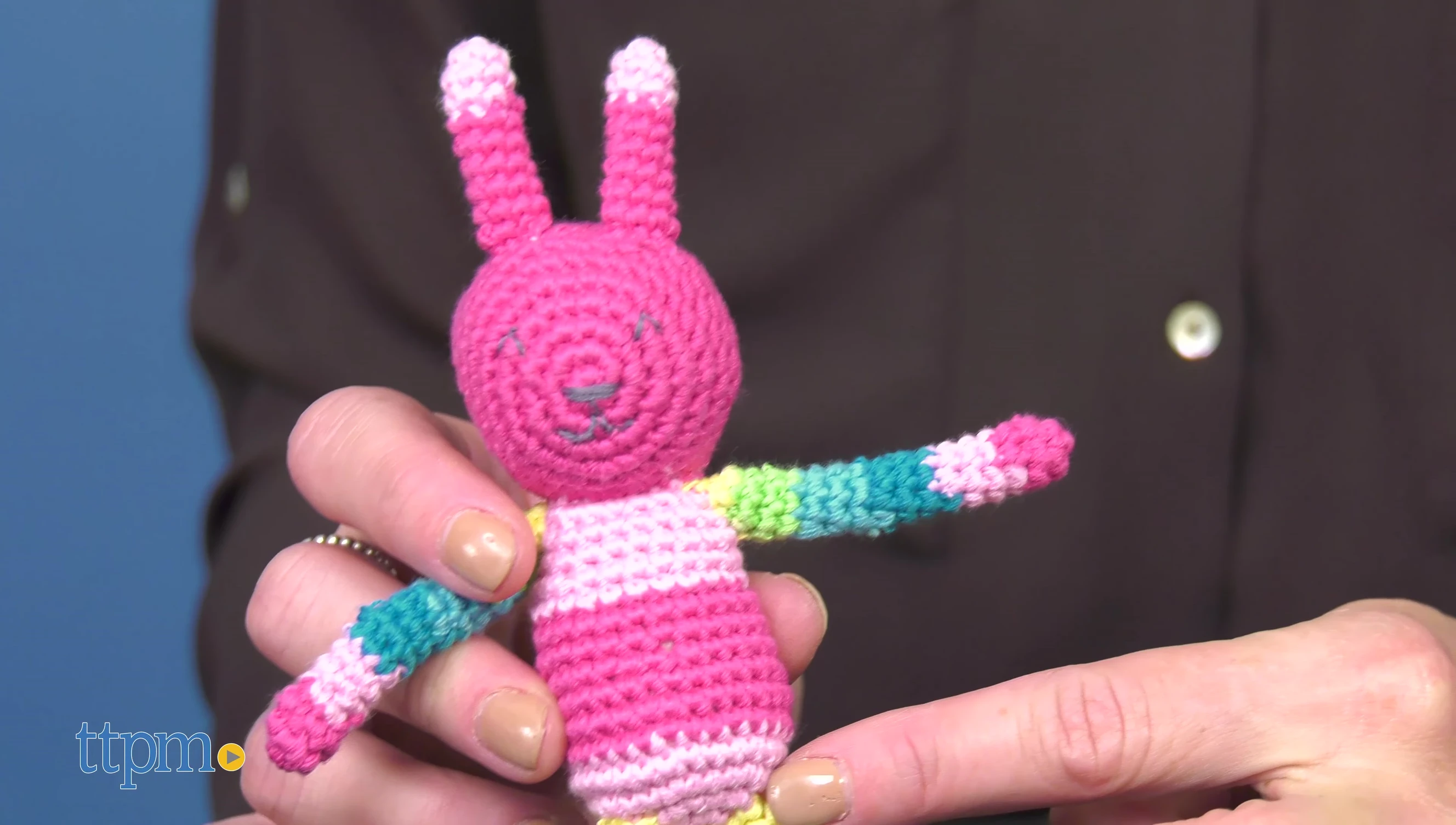A close-up demonstrating the size and texture of the rattle.