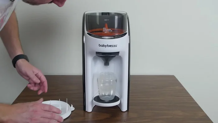 Press the start button to dispense the formula.