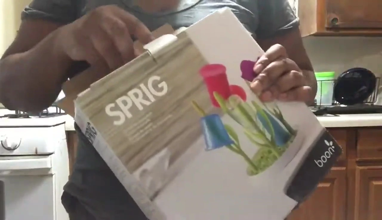 The contents of the Boon Sprig packaging laid out on a surface.
