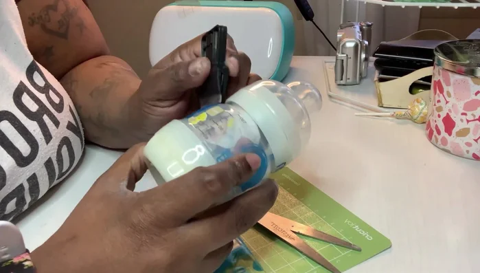 Use a scraper to firmly adhere all vinyl pieces, removing any remaining air bubbles or wrinkles.