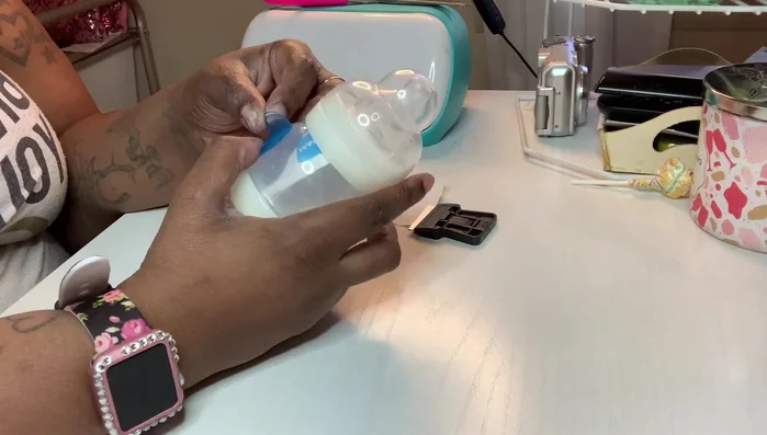 Smooth out any air bubbles as you apply, using a scraper to ensure adhesion and prevent wrinkles. Pay close attention to areas with textured surfaces or grooves.