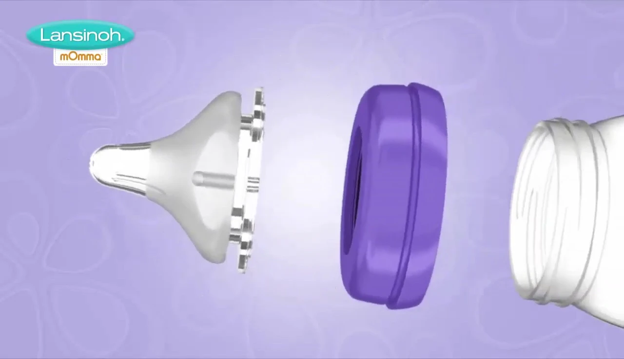 A parent easily assembling and cleaning the Lansinoh bottle.