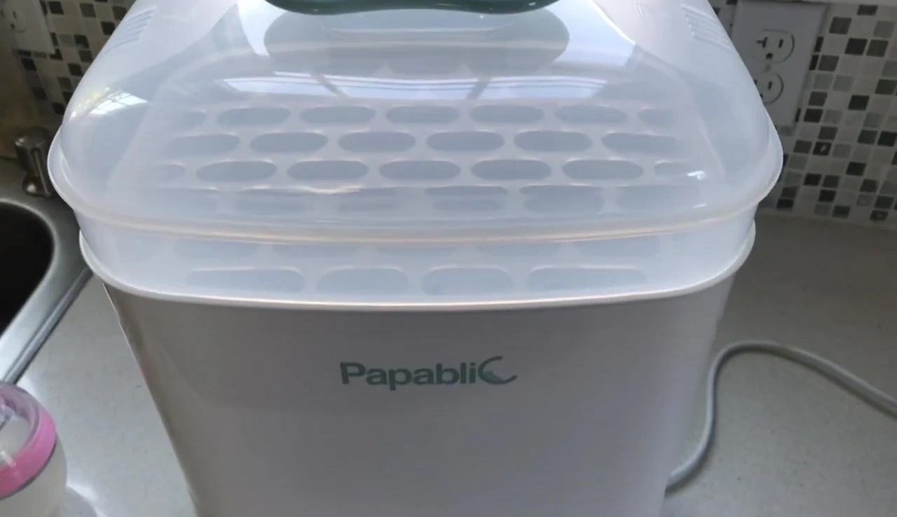 The sterilizer neatly placed on a countertop.