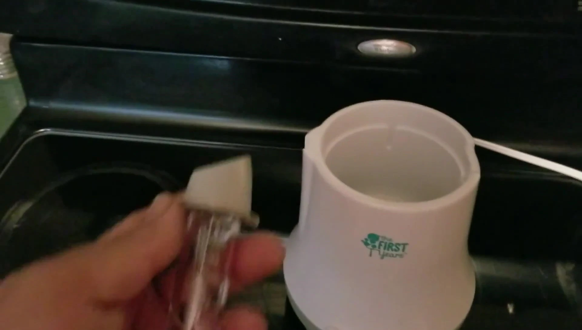 Measuring tube and bottle warmer basket