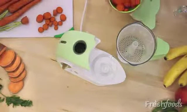 Adding carrots to the steaming basket