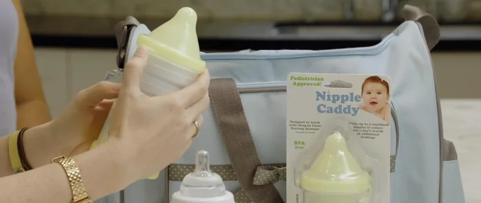 Stack a day's worth of clean, sterilized nipples and collars inside the top compartment.