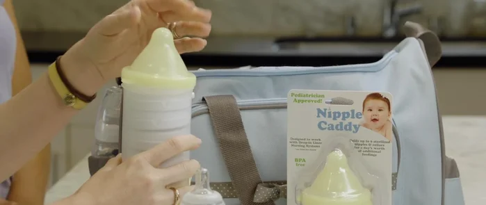 Stack a day's worth of clean, sterilized nipples and collars inside the top compartment.