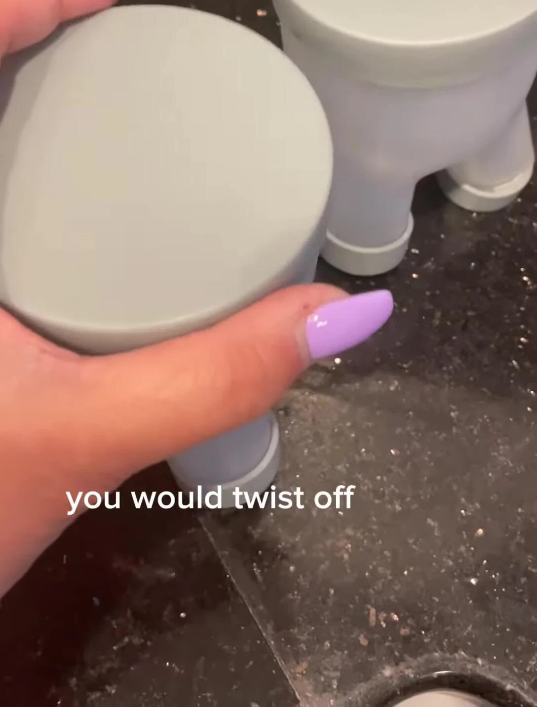 Demonstration of twisting off the top of the container.