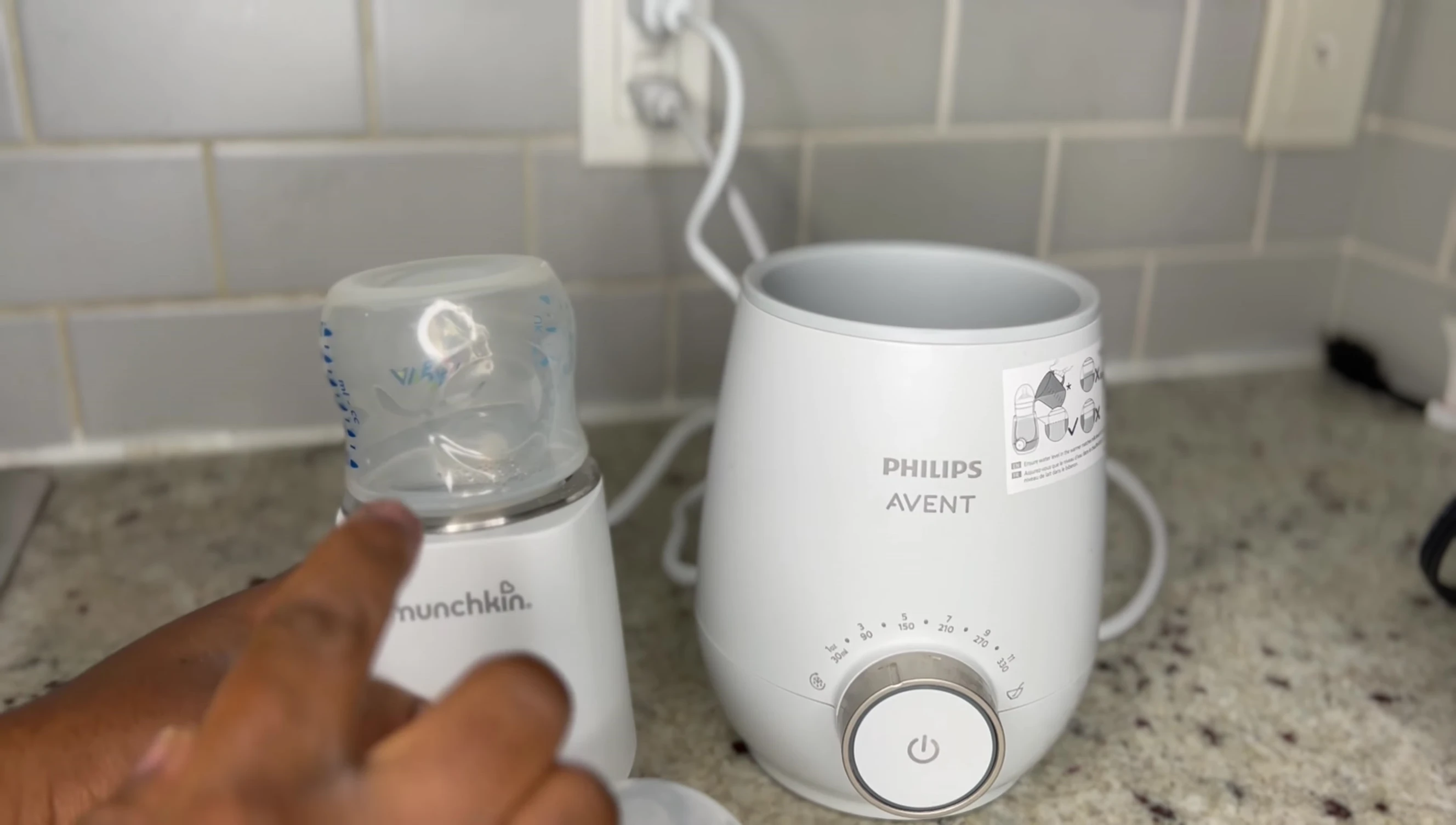 Speaker showing the Munchkin warmer in a bag, highlighting its portability.