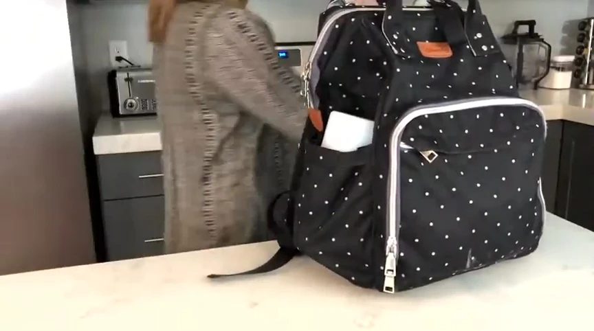 Papablic Mini Bottle Warmer fitting easily into a diaper bag.