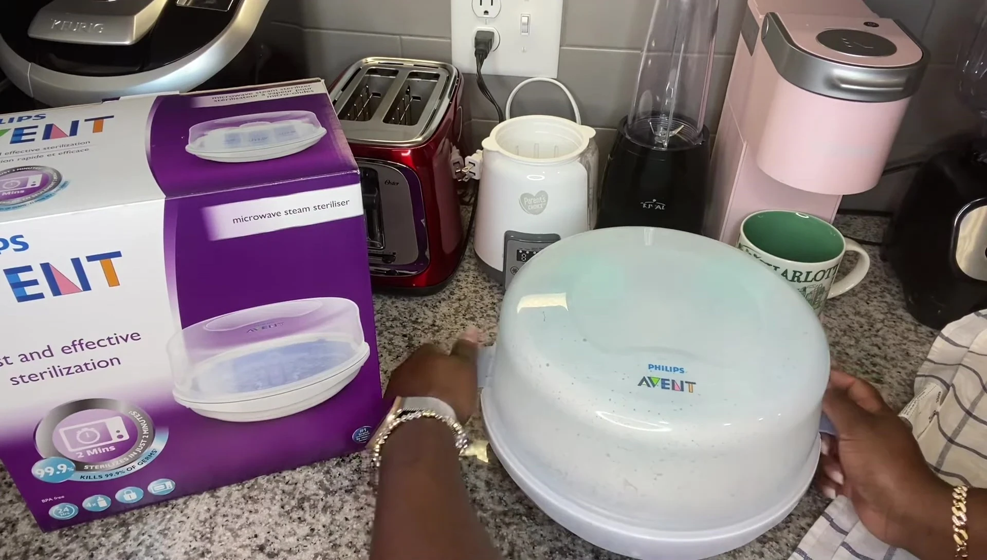Removing sterilized bottles from the Avent Sterilizer