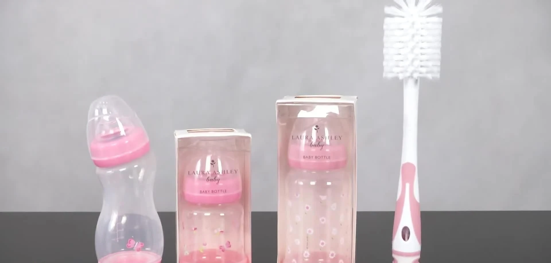 Different sizes of Laura Ashley baby bottles lined up – 5oz, 9oz standard, and 9oz angled.