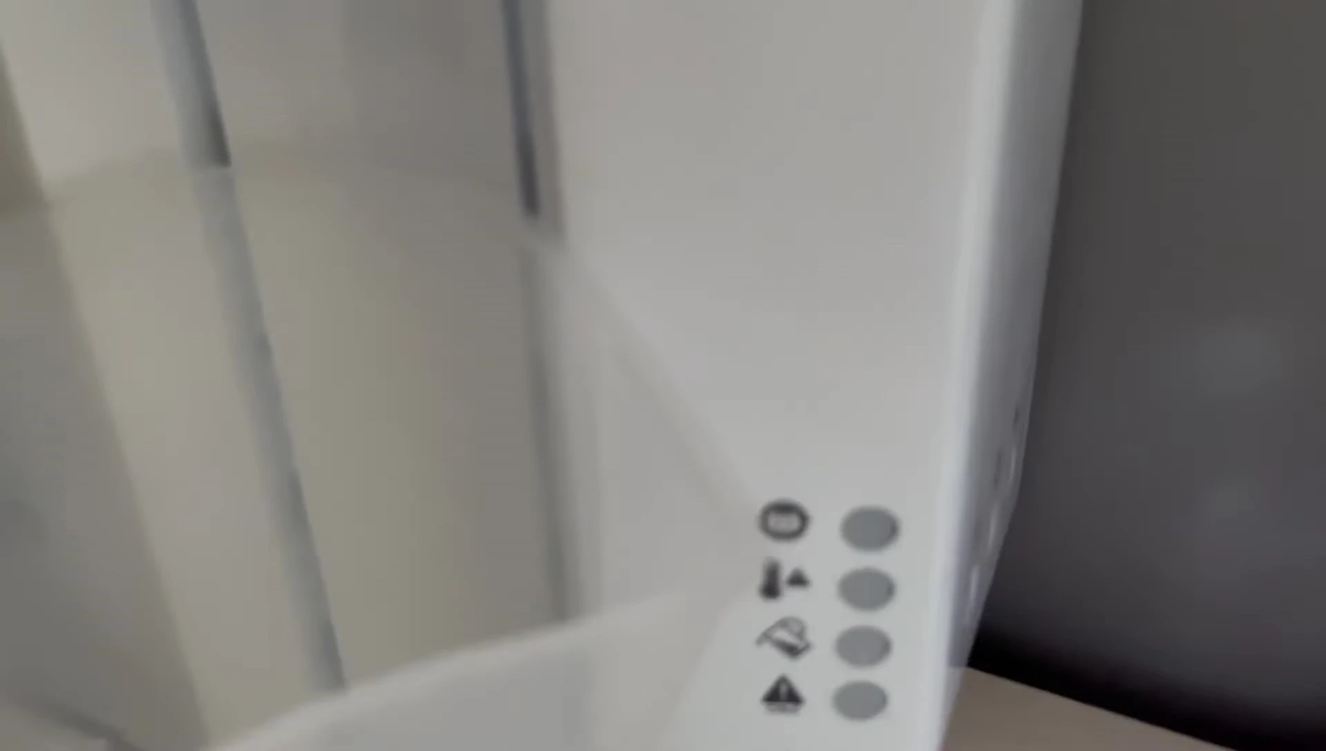 Locating the teardrop-shaped button