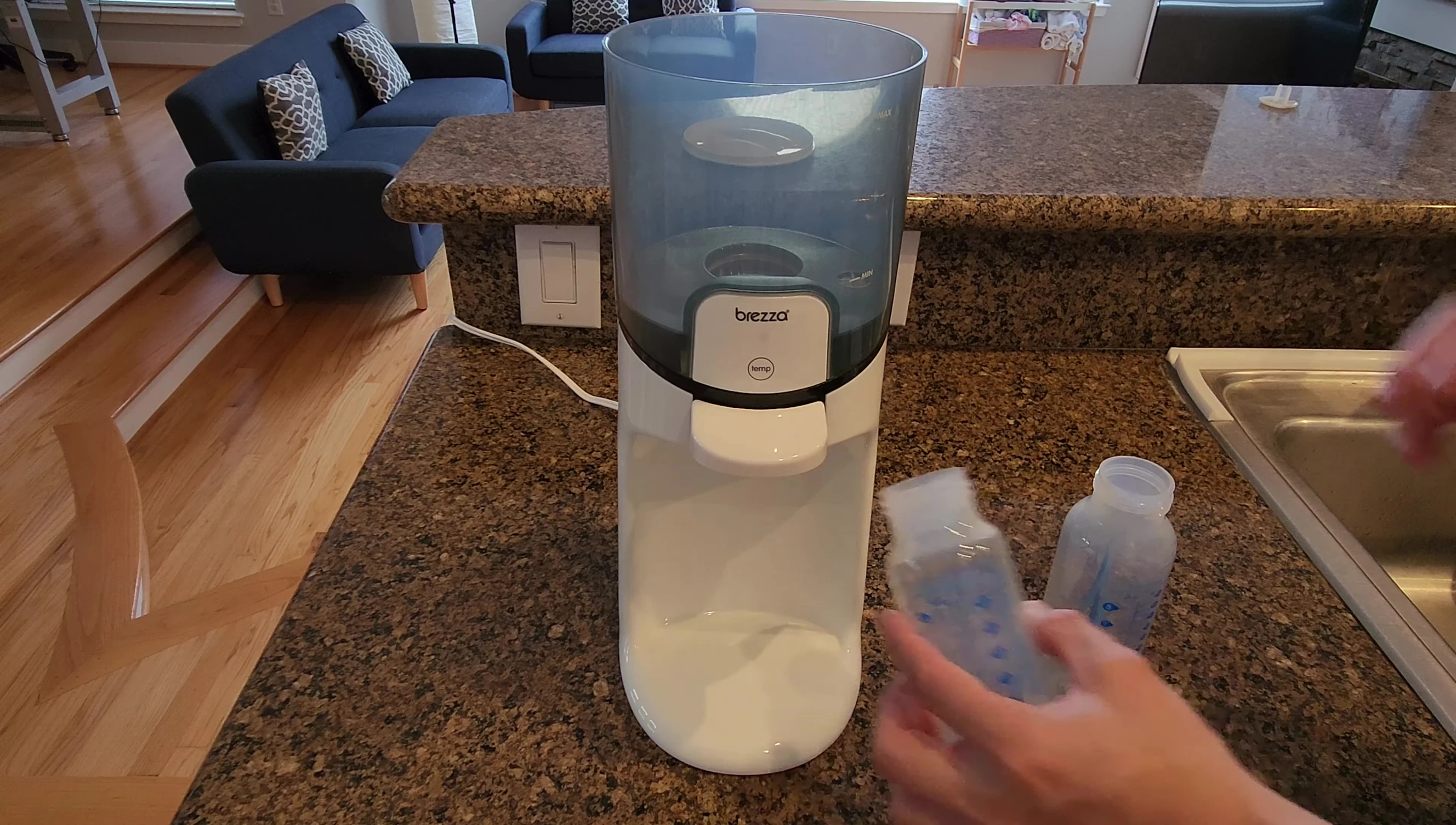 4-ounce Dr. Brown's bottle fitting easily into the warmer