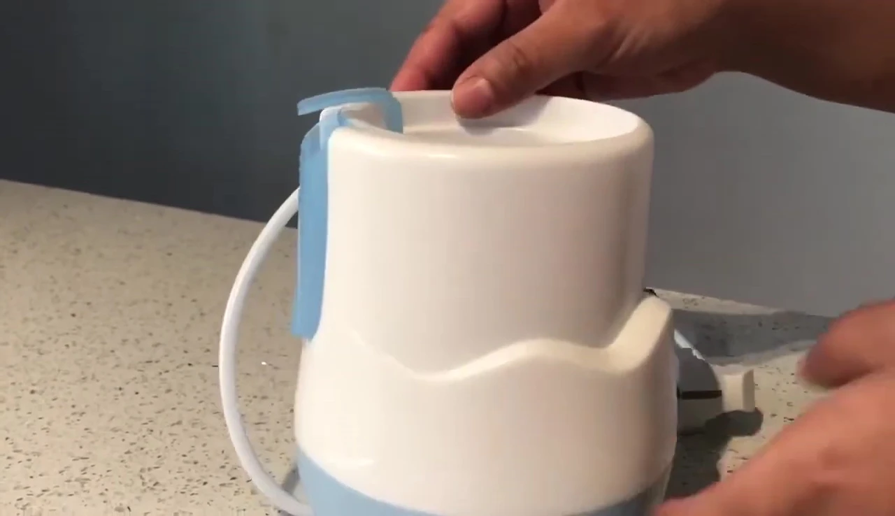 The NUK warmer sitting on a kitchen counter.