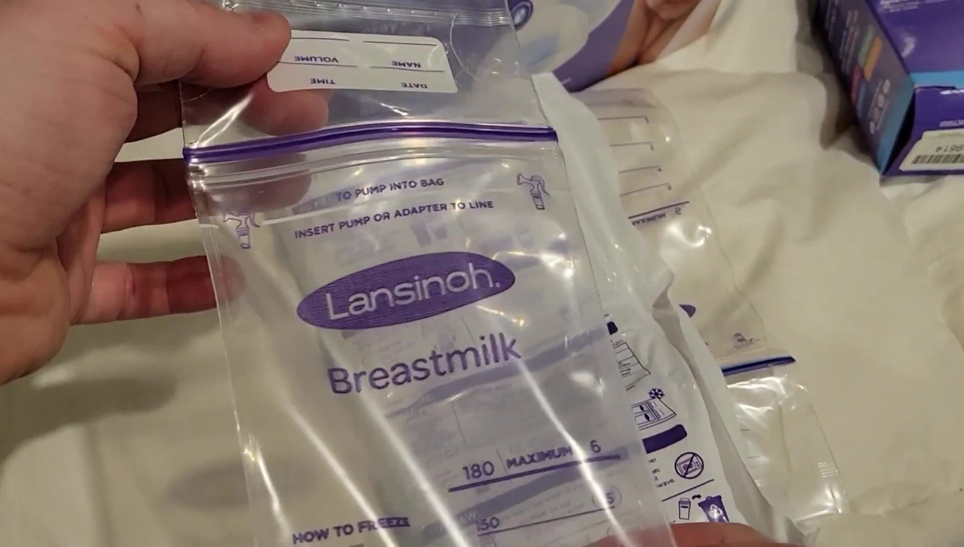 Frozen Lansinoh bags neatly stacked in a freezer.