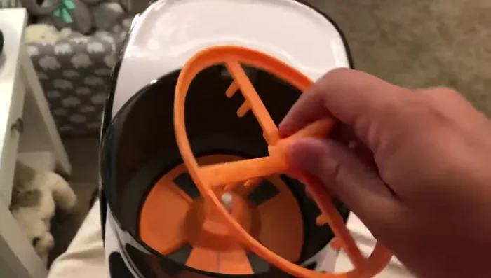 Push the mixing rake down until it clicks into place.