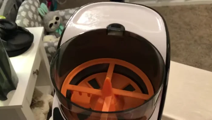 Place the lid on the formula container and ensure it clicks into place.