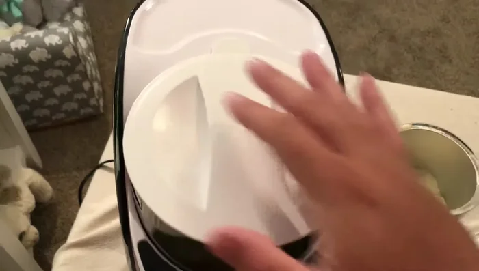 Place the lid on the formula container and ensure it clicks into place.