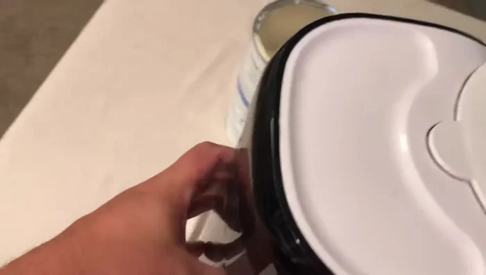 Fill the water tank in the back of the machine.