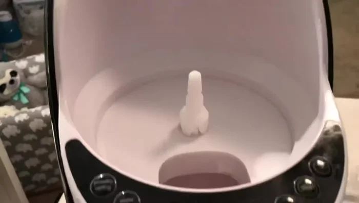 Slide the orange mixing piece into the base.