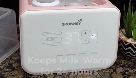 The warmer with baby food inside.