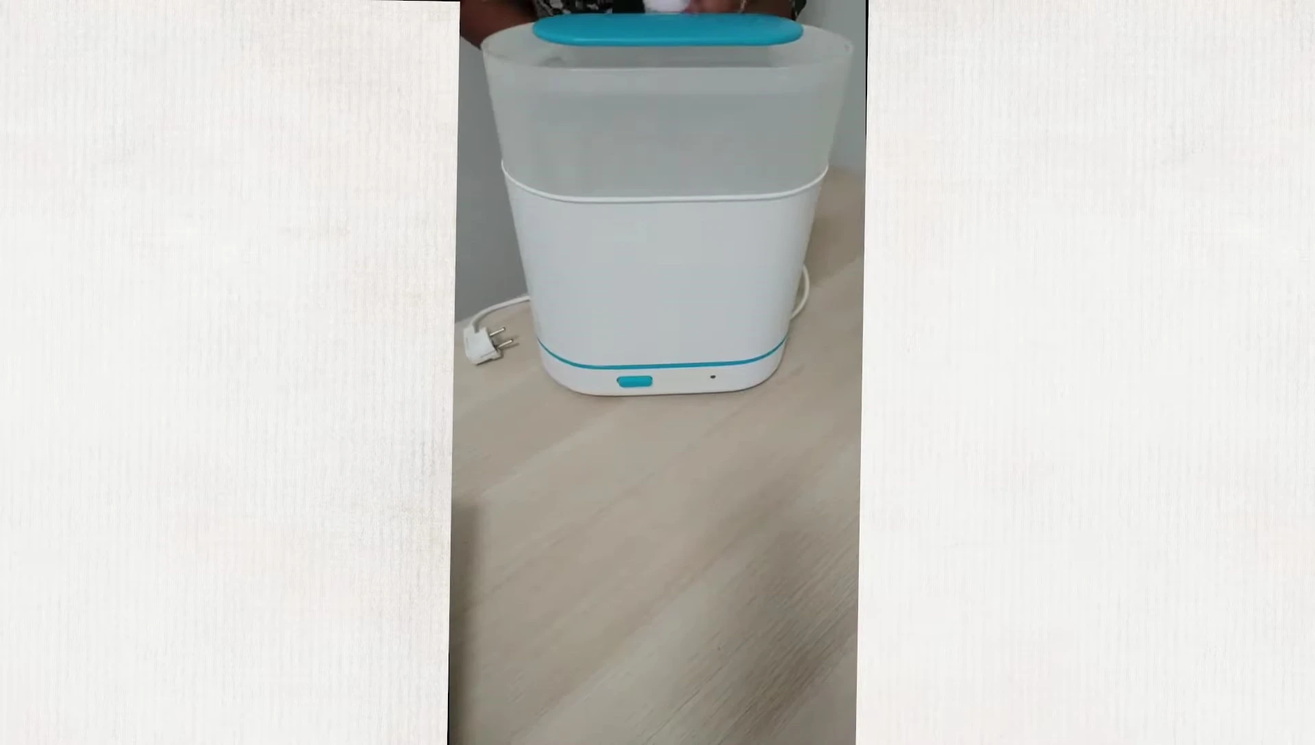 Person washing baby bottles