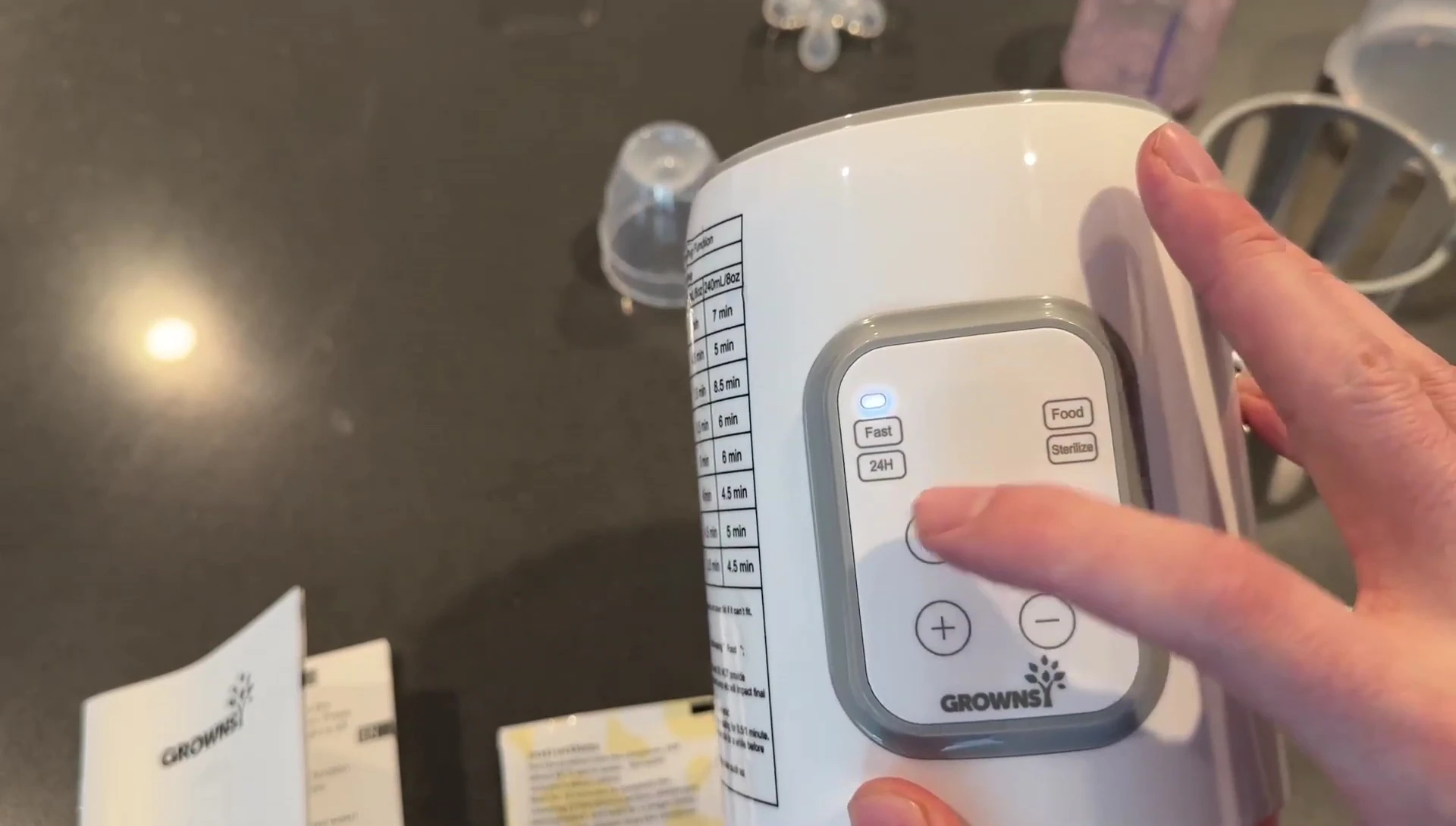 Close up on the button to turn on the warmer