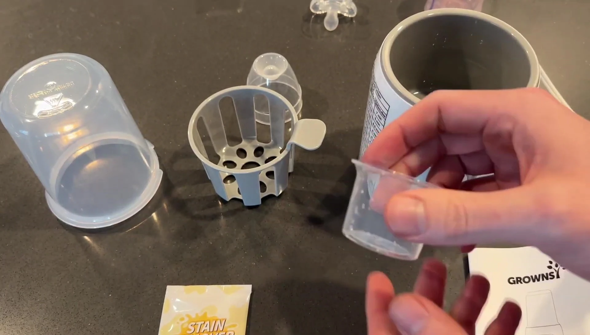 Close-up of the measuring cup and stain remover
