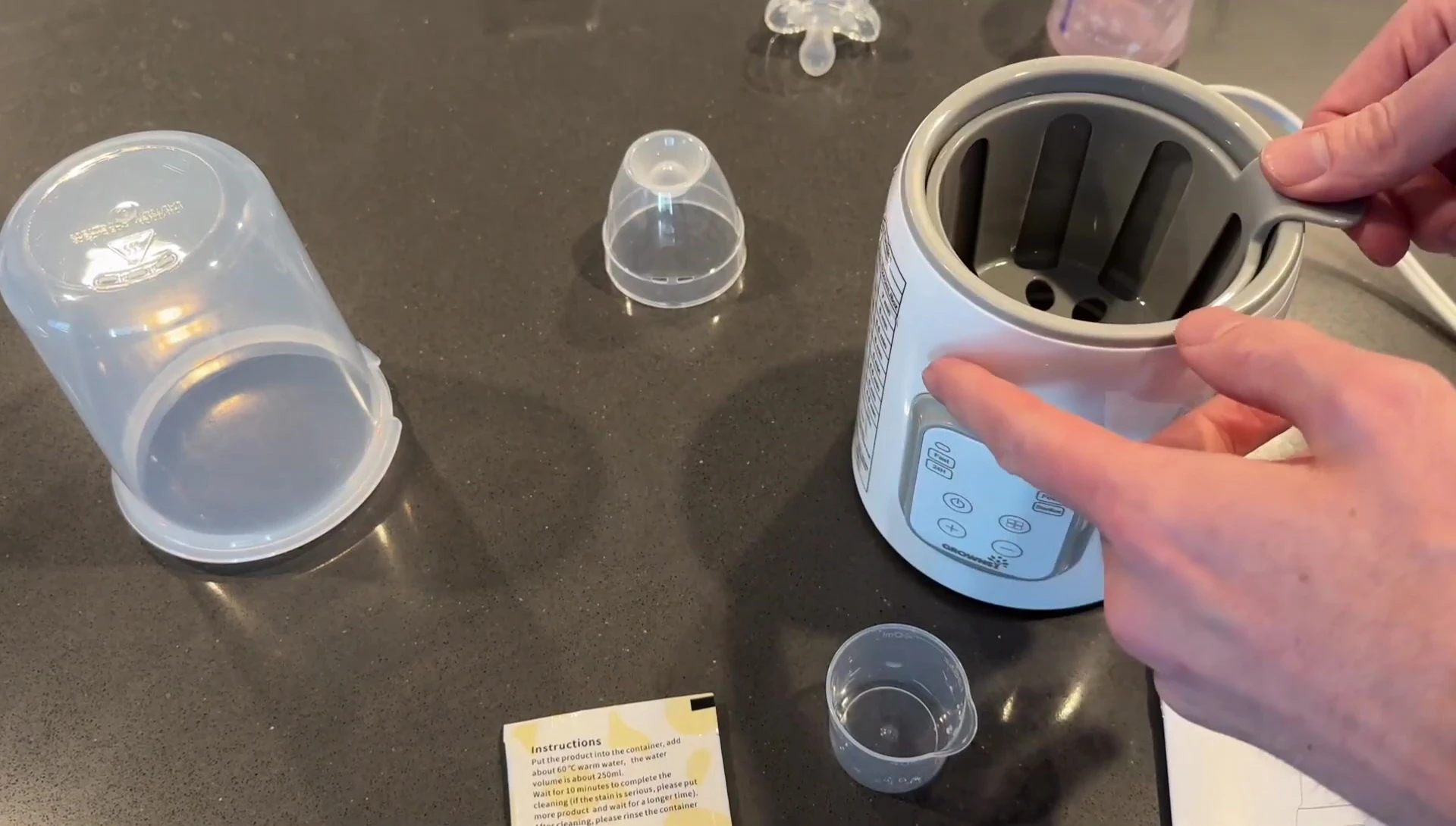 Inner cup shown next to the bottle warmer