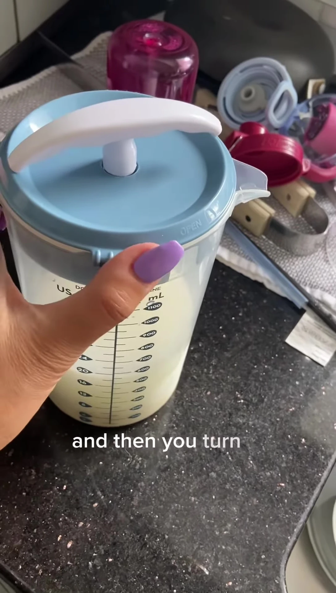 Securing the lid and mixing the formula.