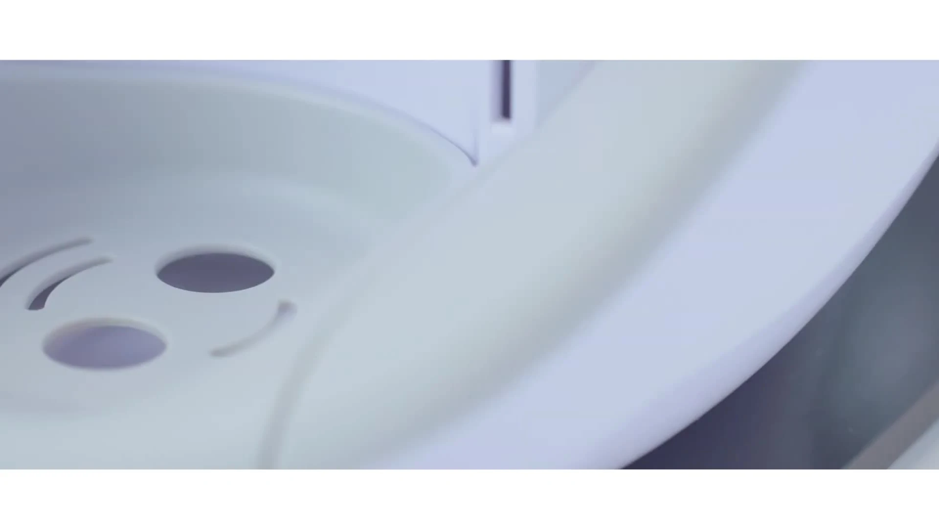 Close-up of the Burabi Smart Formula Milk Maker Pro during operation, highlighting its precise dispensing mechanism.
