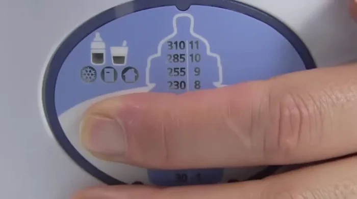 Plug in the warmer and press the mode selection button for three seconds to turn it on.