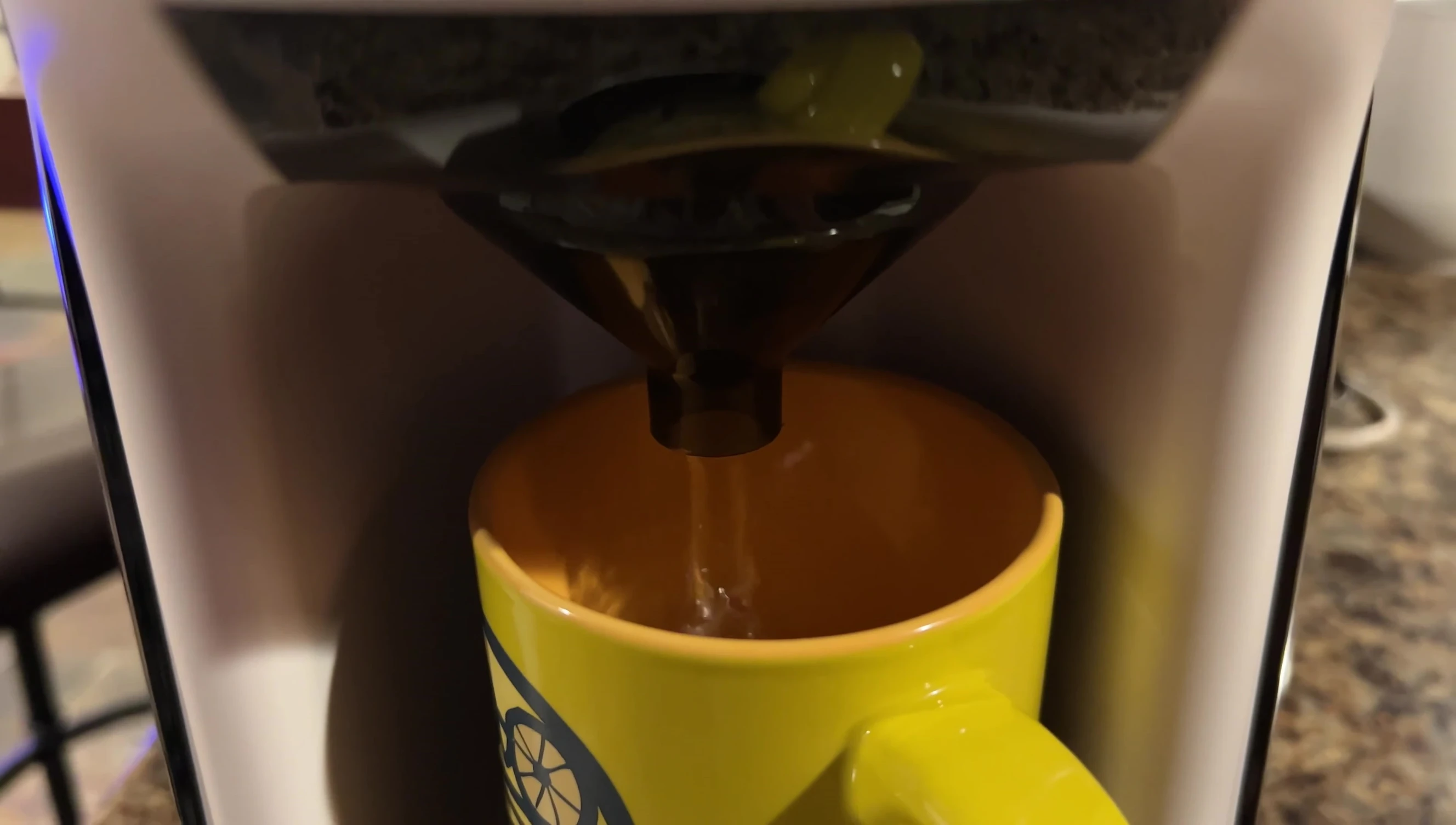 The machine dispensing water during the initial cleaning cycle.