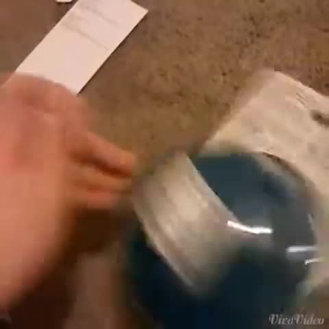 Close-up of the Munchkin formula dispenser packaging being opened