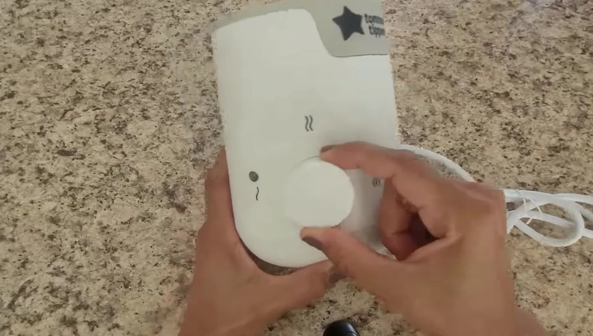 Screenshot showing the speaker demonstrating the temperature setting.