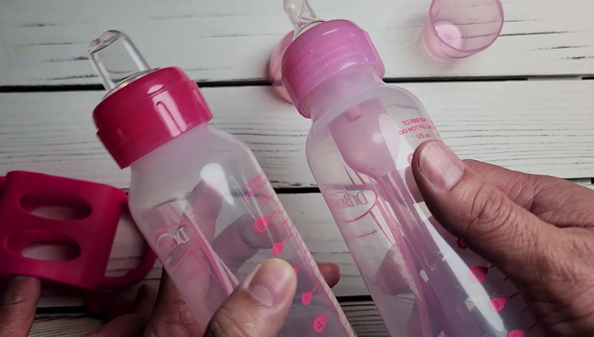 The baby using the Dr. Brown's sippy cup.