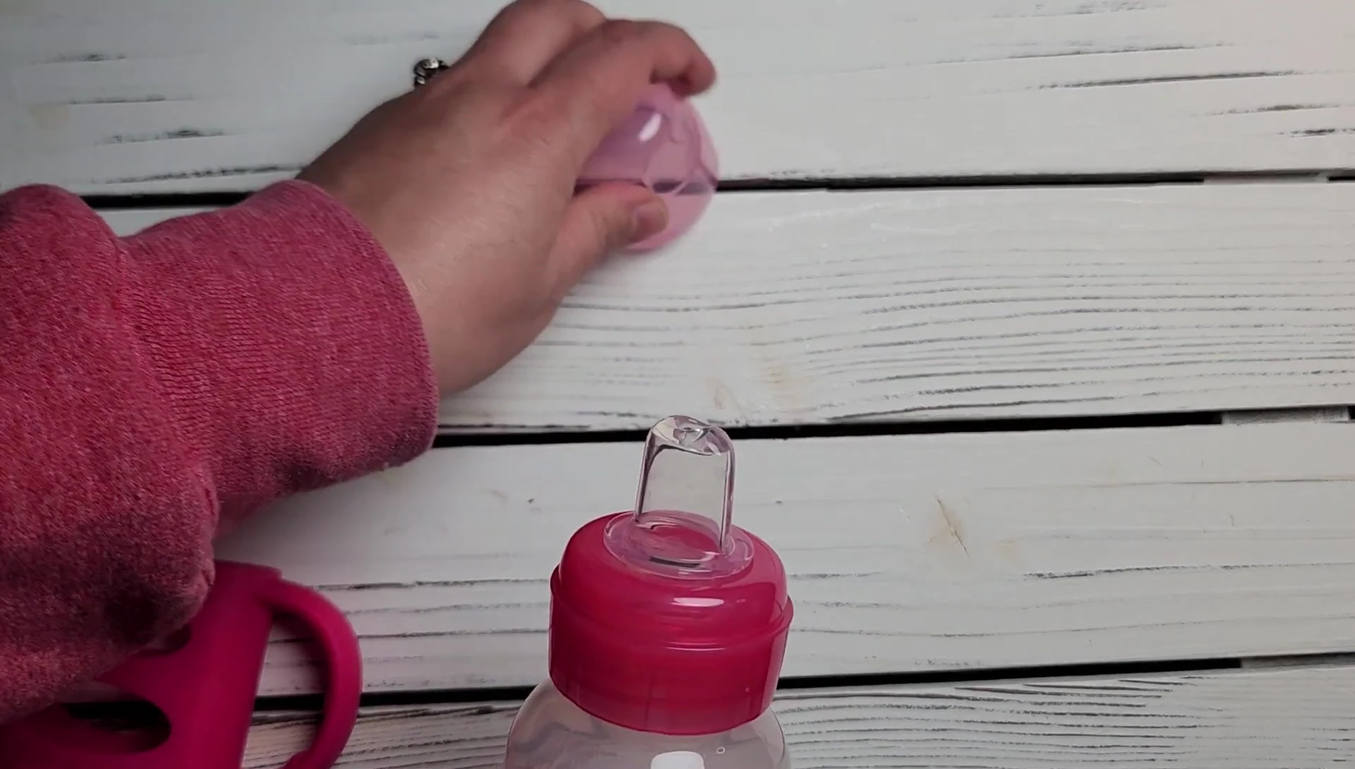Close-up showing the darker color of the sippy cup.