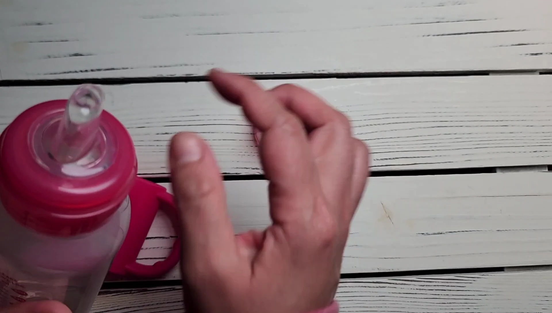 Comparison of the sippy cup spout to a standard bottle nipple.