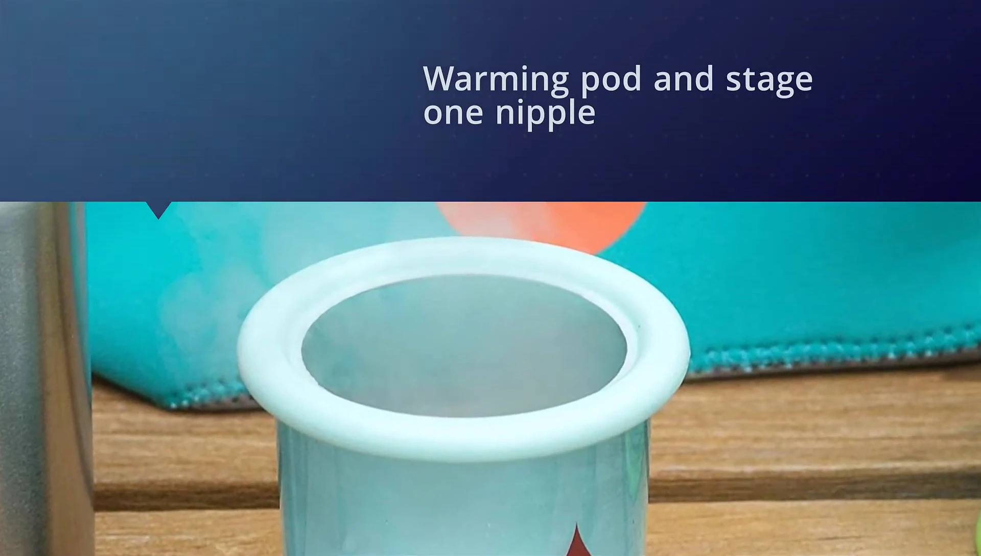Close-up of the Aqua Heat stainless steel bottle and warming pod