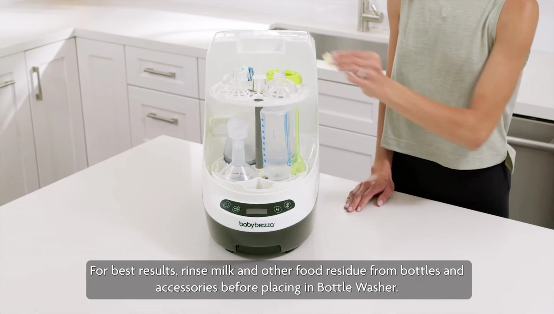 Rinsing bottles and accessories before loading.