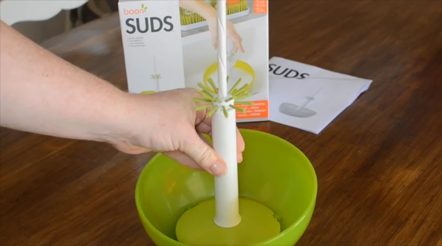 Filling the bowl with soapy water.