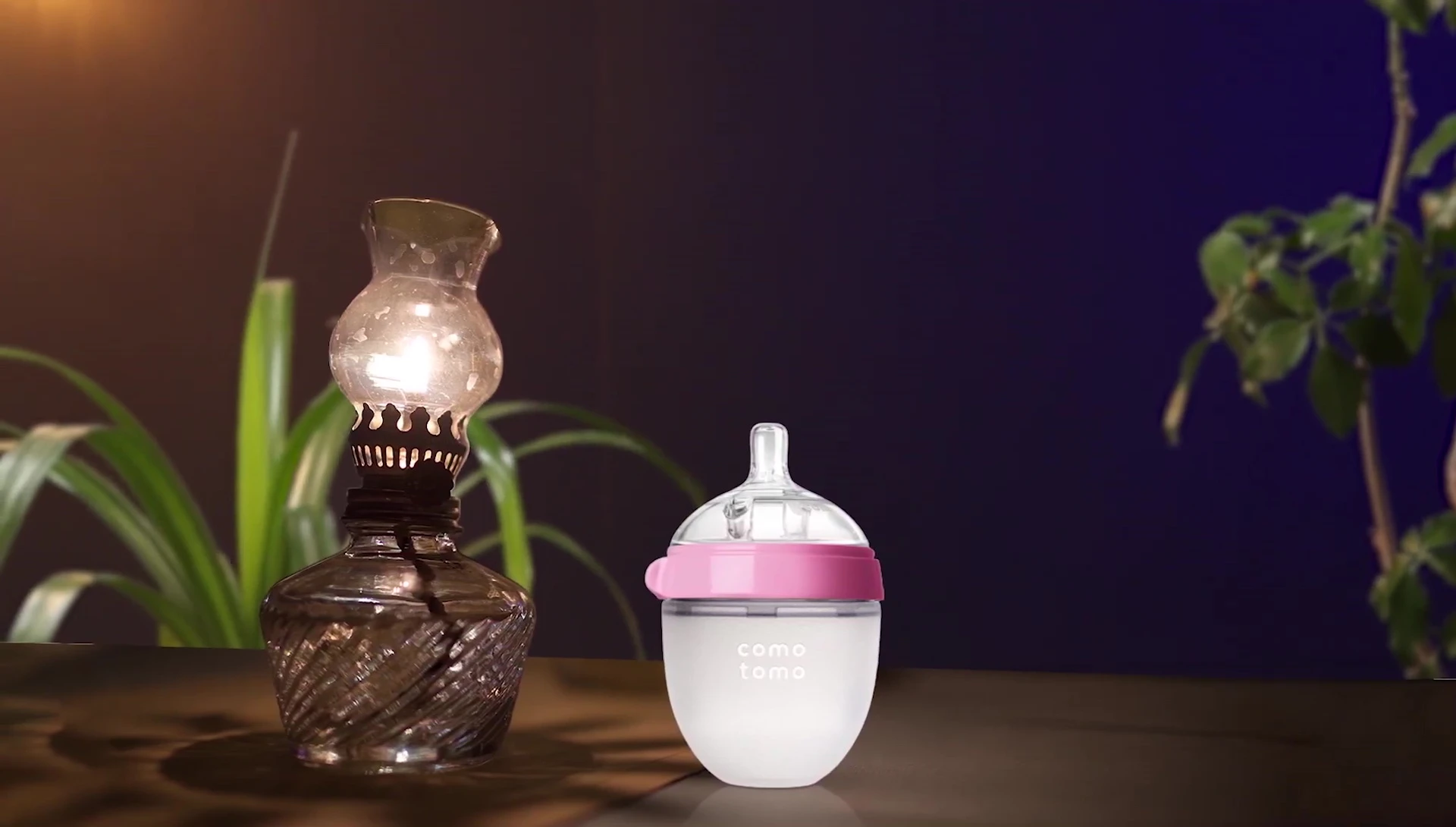 Demonstrating the bottle's no-drip design and 5-ounce capacity.