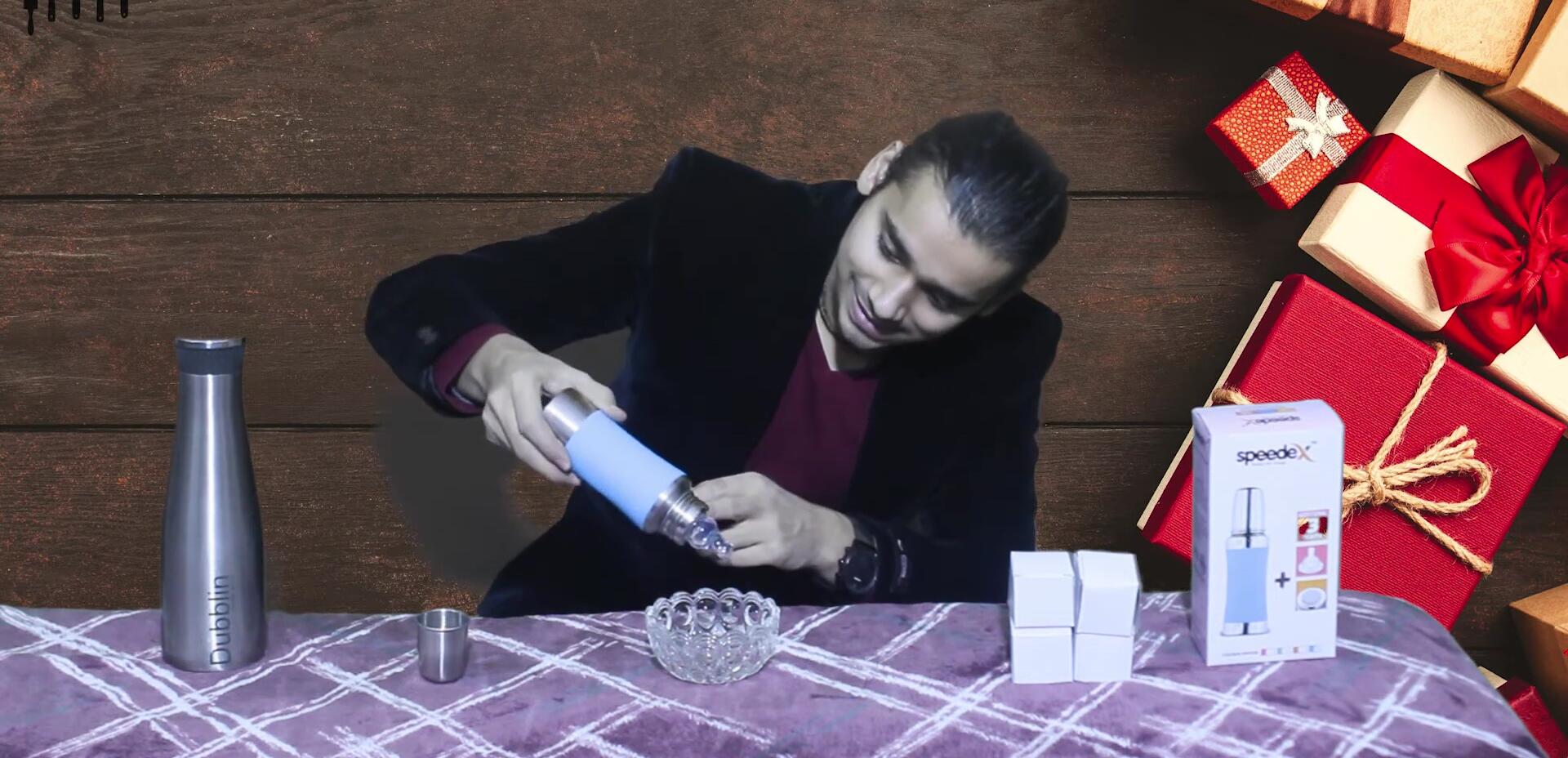 The presenter demonstrating that there are no leaks from the bottle.