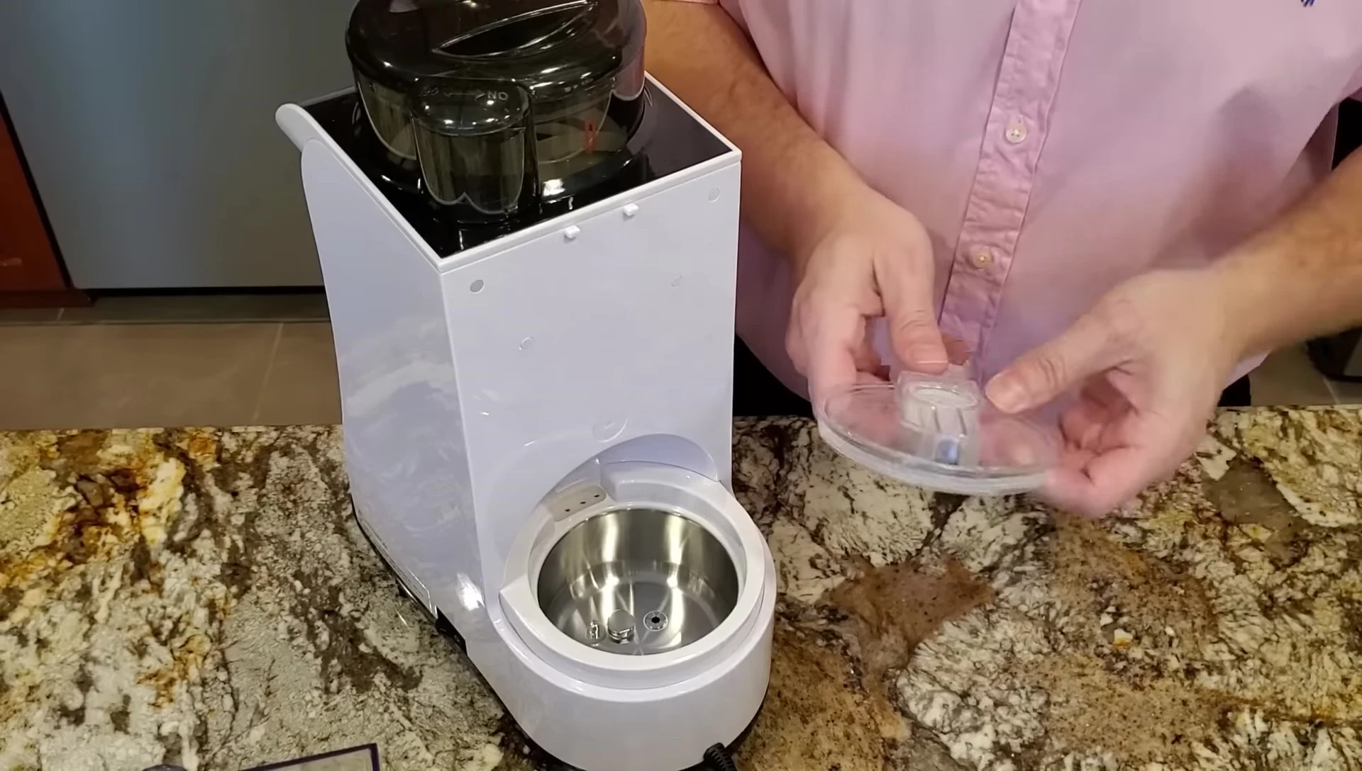 Ensuring the tabs of the water and boiler covers are aligned.