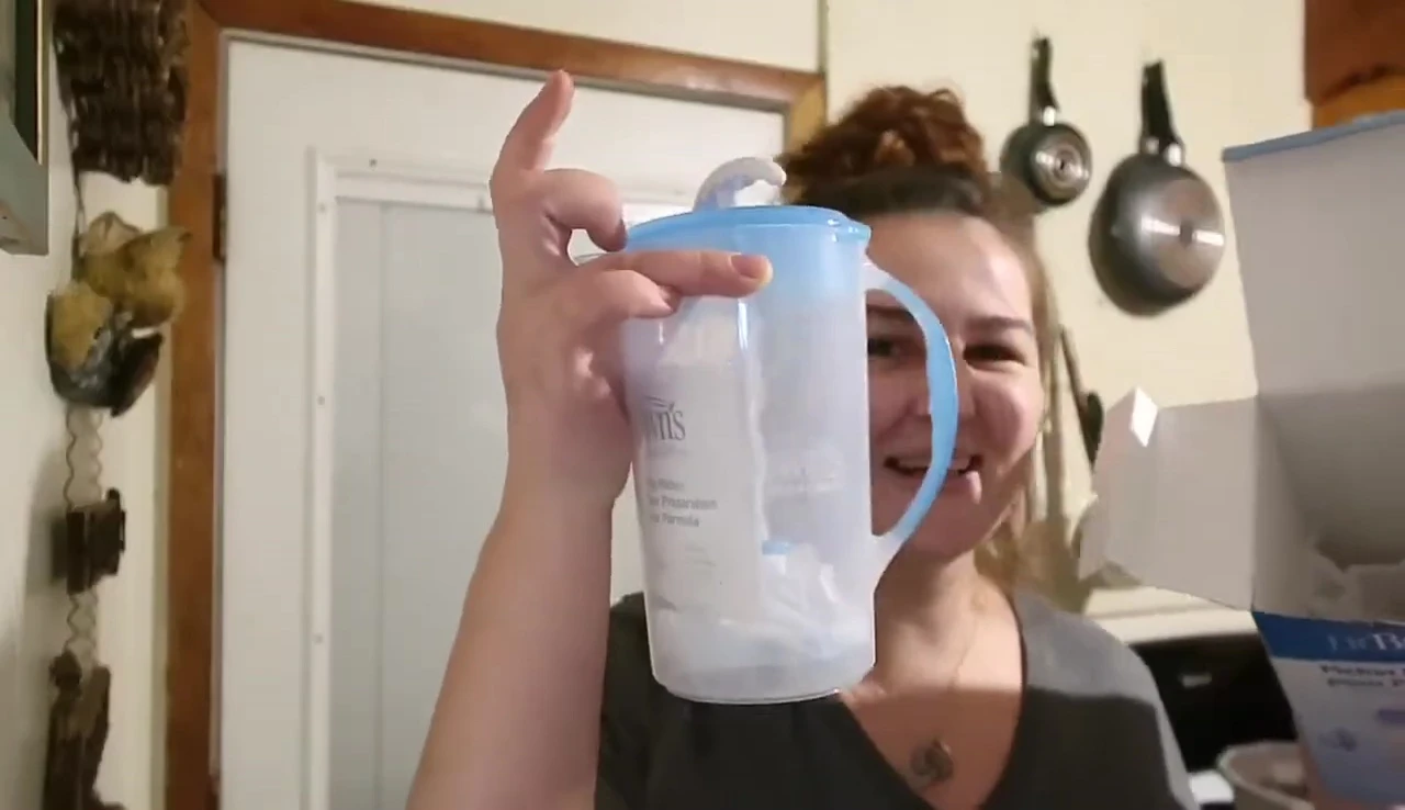 Megan holding up the Dr. Brown's Formula Mixer